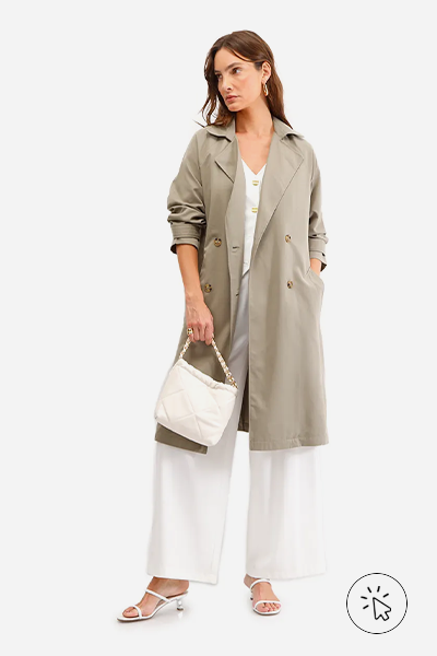 Modelo veste trench coat feminino com amarração verde- cores que combinam com verde - que cor combina com verde militar - que cor de sapato combina com vestido verde - que cor combina com verde claro - que cor combina com verde escuro - que cor de blusa combina com calça verde - look verde - diferença entre verde oliva e verde militar
