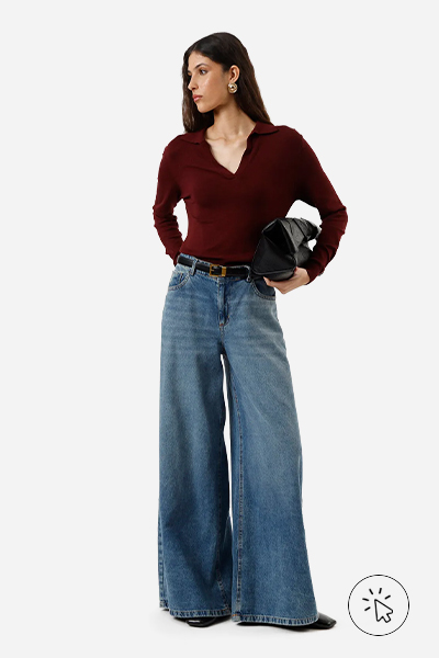 Modelo veste polo de tricô manga longa vinho, wide leg oversized jeans, cinto, bolsa estruturada e sapatilha boneca preta - estilo minimalista - estilo minimalista feminino - o que é estilo minimalista