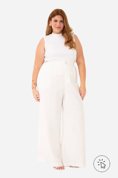 A modelo está usando uma regata e uma calça de alfaiataria off white - look monocromático - o que é monocromático - o que é look monocromático